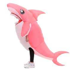 a person in a pink shark costume