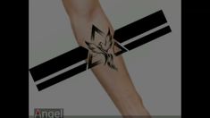 a person with a tattoo on their arm holding a cross and two arrows in the background