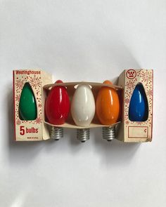 an assortment of different colored eggs in a cardboard box on a white background with the words westinghouse 5 bulbs above them