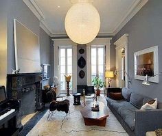 a living room filled with furniture and a piano