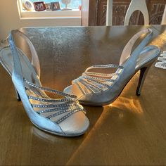 Brand New Silver Dress Shoes W Rhinestones. Sling Back W 3/4” Platform And A 4.5” Heel. Very Comfortable- Abs Gorgeous On! One Minor Defect On Right Heel. Originally $85. New - No Box Elegant Bedazzled Sandals With Round Toe, Elegant Bedazzled Round Toe Sandals, Bedazzled Formal Sandals For Spring, Formal Bedazzled Sandals For Spring, Elegant Bedazzled Sandals For Spring, Party Slingback Sandals With Rhinestones, Fitted Open Toe Sandals With Rhinestones, Open Toe Rhinestone Heels For Dinner, Formal Rhinestone Slingback Sandals