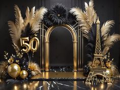 an image of a 50th birthday scene with gold and black decorations on the floor,