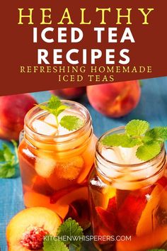 two mason jars filled with iced tea and peaches on top of a blue table