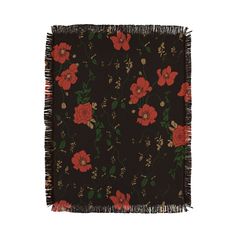 a black and red flowered blanket with fringes on it's edges, in front of a white background