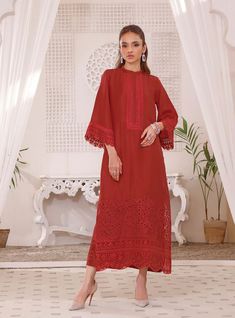 Embroidered Salwar Kameez Pakistani Red Dress for Eid is an elegant masterpiece that wins everyone's hearts at the very first glance. This premium Pakistani Eid Dress comes in premium Raw silk fabric and is gracefully emblazoned with lavish embroideries and lacework. Pakistani Red Dress, Eid Dresses Pakistani, Dress For Eid, Silk Kameez, Red Dress Design, Red Kurti, Zainab Chottani, Salwar Kameez Pakistani, Embroidered Salwar