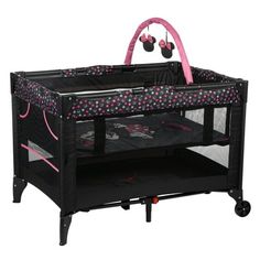 a baby crib with headphones hanging from it's handlebars and wheels