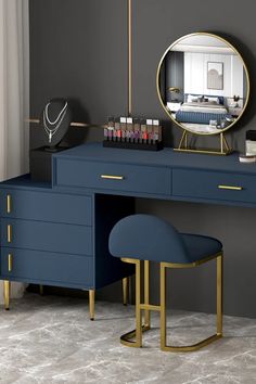 a dressing table with a mirror and stool next to it