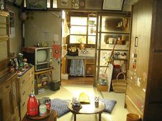 a living room filled with furniture and lots of clutter