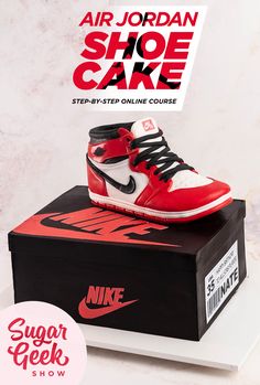 the air jordan shoe cake sits on top of a box and is ready to be eaten