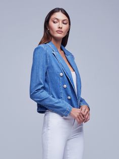 A sleekly designed cropped blazer in a faded bule stretch twill. Military-inspired details include strong shoulders, peaked lapels and tonal anchor buttons trimming the front. Includes a tapered silhouette that highlights the waist. Finished with long sleeves. Elegant Fitted Denim Jacket For Work, Formal Denim Blazer For Spring, Spring Formal Denim Blazer, Classic Denim Jacket With Notch Lapel, Spring Fitted Denim Jacket With Double Button Closure, Fitted Denim Cropped Jacket For Work, Fitted Notch Lapel Denim Jacket For Spring, Fitted Denim Jacket With Notch Lapel For Spring, Tailored Denim Jacket For Spring