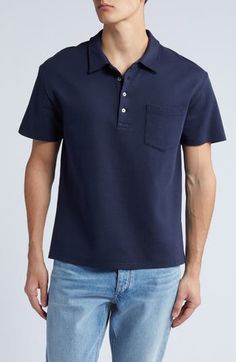 Classic and comfortable, this polo crafted from breathable cotton features a simple patch pocket and a relaxed feel that's perfect for any casual look. 27" length (size Medium) Button half-placket Spread collar Short sleeves Chest patch pocket 100% cotton Machine wash, tumble dry Imported Blue Cotton Polo Shirt With Placket, Classic Blue Polo Shirt With Pockets, Navy Cotton Polo Shirt For Work, Classic Navy Cotton Polo Shirt, Navy Polo Shirt With Button Closure For Work, Navy Cotton Polo Shirt With Button Closure, Navy Polo Collar Top With Pockets, Navy Casual Polo Shirt Relaxed Fit, Casual Navy Relaxed Fit Polo Shirt