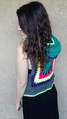 Crocheted hippy flower vest with bright neon flower design on the back  Lines with neon yellow that glows in black light border the entire vest! Complete with vibrant hood Size: one size fits most small to medium people. For reference, in the pictures, I am 5'4 and 130 pounds.  Shipping (Domestic): 2-5 Day Processing Time Sent via USPS First Class Mail, tracking # included Arrives in 5-21 days (depending on location) *Upgraded shipping available Love & Good Vibes in Every Stitch                  Handmade & designed by Erika Michelle  Due to the unique nature of my designs and detailed descriptions, I do not accept returns or exchanges. However, if you are unsatisfied with your item, please contact me directly to find a solution. Im happy to work with you Bohemian Green Vest For Spring, Green Sleeveless Festival Vest, Multicolor Hippie Festival Vest, People For Reference, Flower Vest, 130 Pounds, Neon Flowers, Hippie Flowers, Hooded Vest