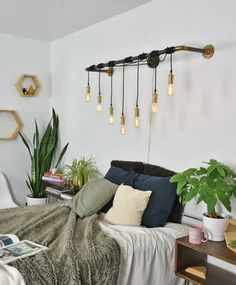 a living room filled with furniture and lots of plants