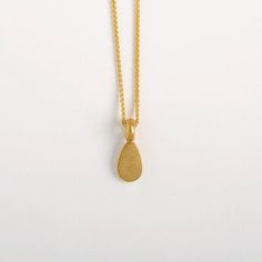 This Egg Shaped Pendant is made of 22k Solid Gold and it is a part from our 'Middle Line' collection. Metal: 22k yellow solid goldGold pendant length: approx. 10 mm (0.4") | width: 6.5 mm (2.5'').Inner diameter of the link: approx. 3 mm. We can make it larger at your request.We chose to use 22 karat gold for our weight pendants, for their high density. It's a small, concentrated pendant, a small object with a satisfying weight to it, keeping it centered on its chain.Whether around the neck, clos Gold Teardrop Hammered Necklace, Gold Plated Yellow Gold Drop Necklace Gift, Gold Plated Yellow Gold Drop Necklace As Gift, 22k Gold Teardrop Jewelry, 22k Gold Teardrop Jewelry Gift, Yellow Gold Plated Drop Necklace As A Gift, Minimal Pendant, Minimal Gold, Wedding Pendant