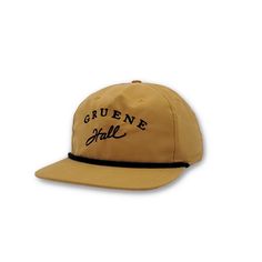 a brown hat with the word grune hall on it's front and side