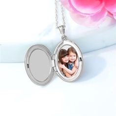 * Oval locket is custom laser printed using your uploaded photo * Engrave any message or name on front of locket * Comes with 18 cable chain  * Locket measures 1 x 3/4 * Clasp Type: spring ring * Approx. weight: 4.7 Grams * Made of Sterling Silver * Made in USA  Give a truly unique and custom gift with this Engraved Photo Oval Locket. Simply upload your most precious photo to have it permanently laser printed in the locket.  A perfect gift for Mother's Day, birthdays, or just because. Customizable Round Silver Locket Necklace, Personalized Silver Customizable Locket Necklace, Customizable Silver Locket Necklace For Personalized Gift, Personalized Oval Pendant Locket Necklace, Silver Customizable Locket Necklace For Personalized Gifts, Nickel-free Oval Pendant Locket Necklace For Keepsakes, Personalized Oval Pendant Locket Necklace For Keepsake, Personalized Oval Locket Necklace For Keepsake, Personalized Oval Pendant Locket Necklace As A Gift