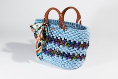 This Handmade Crochet Luxury Woman Bag is  made with Metallic 100%  Polyester T-Shirt Yarn. DIMENSION: Length: 10' Height: 7' Width:4' MATERIAL: Metallic 100%Polyester T-Shirt Yarn Feel free to message me for further details This bag can be made in different size or colors combination.  Thank you for visiting my shop Blue Top Handle Bags With Braided Handles, Blue Bags With Braided Top Handles, Blue Shoulder Bag With Rolled Handles For Shopping, Blue Rectangular Shoulder Bag With Rolled Handles, Blue Crochet Tote Bag For Shopping, Blue Rectangular Bag With Braided Handles, Casual Blue Bags With Rolled Handles, Blue Crochet Travel Bag With Double Handle, Blue Crochet Bag With Handles For Everyday Use