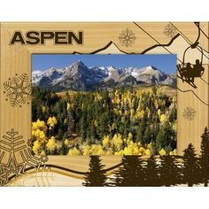 an aspen photo frame with snowflakes and mountains in the background