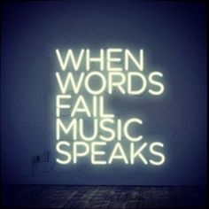 a neon sign that says when words fail music speaks