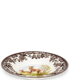 a brown and white plate with deer on it