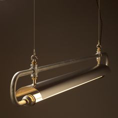 a light fixture hanging from a ceiling with two lights attached to the side of it