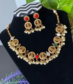 An elegant set for your local gatherings or parties. Height of the earrings: 4 Cm Width of the earrings: 2 cm Care Instruction : Avoid Heat & Chemicals Like Perfume, Deo, Alchol, Etc. | Clean With Dry Cotton Cloth | Pack In our Anti tarnish box after use. White Temple Jewelry For Navratri, Festive Multicolor Spiritual Temple Necklace, Multicolor Jewelry Sets With Latkans For Navratri, Multicolor Necklace For Puja And Navratri, Multicolor Jewelry Sets With Latkans For Puja, Multicolor Temple Necklace With Latkans For Festivals, Multicolor Jewelry Sets For Puja And Festive Occasions, Multicolor Necklaces For Puja And Diwali, Multicolor Temple Necklace For Diwali