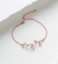 So lovely and delicate.  I created this bracelet in rose gold finish with Premium European crystals.  A romantic leaf design perfect for weddings or everyday.   Bracelet pictured measures 6 inches and extends to 8 inches. Bracelet is .5 inch wide. PLEASE ALLOW APPROX 7 BUSINESS DAYS FOR COMPLETION BEFORE SHIPPING This is an original design by © Treasures by Agnes MATCHING PIECES: https://www.etsy.com/listing/485297202/bridesmaid-necklace-rose-gold-necklace?ref=shop_home_active_2 https://www.etsy.com/listing/511298012/rose-gold-earrings-crystal-bridal Feel free to contact me with any questions !  Thank you for visiting ! Treasures570  Back to main page of Treasures570 for more beautiful designs https://www.etsy.com/shop/treasures570?ref=hdr_shop_menu All pieces come beautifully gift wrapped Dainty Rose Gold Bracelets For Wedding, Adjustable Delicate Rose Gold Diamond Bracelet, Elegant Rose Gold Crystal Bracelet For Anniversary, Delicate Rose Gold Cubic Zirconia Bracelets, Elegant Rose Gold Chain Bracelet For Wedding, Dainty Rose Gold Chain Bracelet With Cubic Zirconia, Dainty Rose Gold Cubic Zirconia Chain Bracelet, Elegant Gold Crystal Bracelet As Bridesmaid Gift, Dainty Rose Gold Chain Bracelet For Anniversary