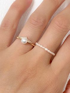 14k Gold Plated Dainty Pearl Ring. Delicate and unique, perfect for wear alone or stack with other rings.    Size:  Open Band/ Adjustable - one size fit all Material: 14k gold plated brass, cubic zirconia, natural freshwater pearl  Gift wrapped, Ready to give Pearl Ring Stack, Dainty Pearl Ring Perfect For Gift, Gold Wedding Birthstone Ring, Fine Jewelry Stackable Pearl Ring For Anniversary, Delicate Stackable Pearl Ring For Anniversary, Affordable Gold Dainty Pearl Ring, Classic Tiny Midi Rings For Wedding, Classic Tiny Midi Wedding Rings, Tiny Open Ring Wedding Jewelry