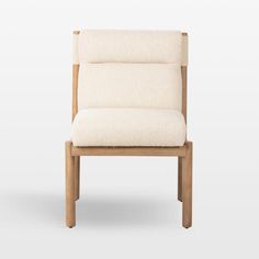 a white chair sitting on top of a wooden frame