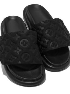 Slip into some serious style with the Bonita Black Slides! With a designer-inspired adjustable strap and chunky sole, you'll be sure to stand out in the best way on your summer getaway. With their sleek matte black color, they go with almost any outfit and make for an instant cool-girl look. Enjoy the sun in style! Black Summer Slides With Rubber Sole, Chic Black Sandals With Rubber Sole, Trendy Black Slides With Textured Footbed, Designer Synthetic Slides For Summer, Black Slides With Rubber Sole For Vacation, Black Sandals With Textured Sole For Spring, Trendy Round Toe Sandals For Streetwear, Trendy Streetwear Slides For Spring, Black Slides With Rubber Sole For Spring