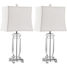 pair of modern glass and chrome table lamps with white linen shades on each lamp base