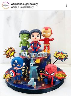 a birthday cake decorated with superheros and captain america figurines on top of it