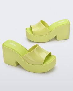 Posh Platform in Yellow – Melissa Shoes Trendy Closed Toe Platform Slippers, Trendy Closed Toe Platform Slippers With Padded Heel, Trendy Summer Slip-on Clogs, Trendy Green Open-heel Mules, Summer Chunky Platform Clogs, Trendy Open Toe Slides With Padded Heel, Casual Chunky Platform Heels, Spring Retro High Heel Mules, Synthetic Open Toe Platform Clogs