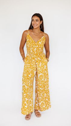 LIMITED RESTOCK CAPSULE. Stand out in this stunning jumpsuit, made to flow with buttery soft rayon and an exaggerated wide pant leg. Features adjustable straps and a gentle smocked waist to flatter. ** Our Model is 5'8" and wearing a size SMALL. ** Fabric and Care Instructions: *100% Rayon *Hand wash cold * Line Dry V-neck Jumpsuits And Rompers With Smocked Back For Vacation, Beach Maxi Dress With Elastic Waistband, Beach Maxi Dress With Elastic Waistband And Wide Leg, Summer Bohemian Jumpsuits And Rompers With Smocked Back, Bohemian Summer Jumpsuits And Rompers With Smocked Back, Bohemian Jumpsuits And Rompers With Smocked Back For Spring, Casual Wide Leg Maxi Dress For Vacation, Chic Summer Rayon Jumpsuits And Rompers, Summer Loungewear Jumpsuits And Rompers With Smocked Back