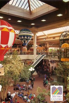 several hot air balloons are being flown in the mall