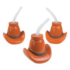 three plastic toy cowboy hats with straws in them