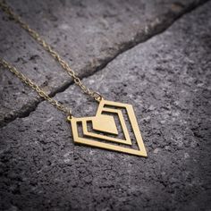 Geometric necklace gold diamond necklace diamond shape by ByYaeli Gold Triangle Metal Jewelry, Diamond-shaped Gold Necklaces For Gifts, Minimalist Pyramid-shaped Jewelry For Gifts, Minimalist Triangle Metal Necklace, Minimalist Triangle Brass Jewelry, Minimalist Diamond-shaped Necklace For Gift, Modern Diamond-shaped Necklace As Gift, Modern Diamond-shaped Necklace As A Gift, Dainty Gold Triangle Jewelry