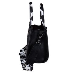 Add some cow-tastic style to your day with this Moo print Wrangler 2-in-1 tote and crossbody! Featuring a concealed carry pocket, this unique bag combines fashion and function for any adventure. Yee-haw! Details: Made of canvas and PU leather Cow Print with whipstitch detail Wrangler logo on the front Top zipper closure Inside of the bag includes a zippered pocket and an open pocket A zippered pocket on the back to conceal your "pew" (9"x 5") Double round handle cow print trimmed (Drop: 5.5") De Casual Cheap Cow Print Bag, Casual Cow Print Bags For Daily Use, Black Bag With Cow Print For Everyday Use, Cow Print Purse, Brown Cow Print Bag, Yee Haw, Moissanite Necklace, Unique Bags, Print Tote