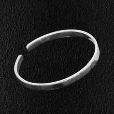 Made from 999 Fine Silver, this bangle is a piece of pure precious metal for your wrist. It is as close as you get to pure silver, short of digging it out of the ground yourself. Naturally, it will have that unique silver tone to it that only silver has. It is stamped, as Fine Silver is, with 999 and the mark of the individual that made it. Your browser does not support our video. It will easily bend to fit most 'normal' size wrists. Not recommended if you have a particularly large wrist. Materi Nickel-free White Gold Sterling Silver Bangle Bracelet, Nickel-free White Gold-toned Sterling Silver Bangle Bracelet, Minimalist Sterling Silver Bangle With Shiny Finish, Minimalist Silver Bracelet With Simple Design, Silver Sterling Bangle With Shiny Finish, Silver Sterling Silver Bangle With Shiny Finish, Silver Sterling Silver Bangle With Polished Finish, Silver Bangle With Shiny Finish, Minimalist Sterling Silver Bracelet With Shiny Finish