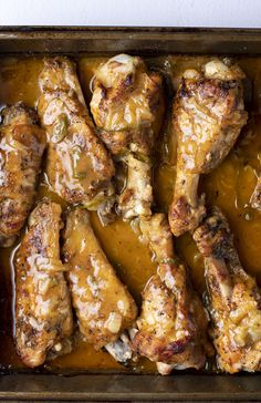 chicken with gravy in a baking pan