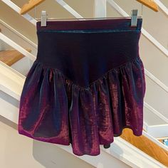 New Never Worn. Iridescent Black Skirt With Bright Shines Of Magenta And Blue. Almost Has Purple And Green Hints. High To Mid Waist. V Design. Full And Flowy. Light Weight. Size: Small On Tag. Could Be Xs By Measurements. 12.5” Elastic Waist Mini Skirt At 17” Long Will Ship Within 24 Hours (From Charlotte, Nc) Shein Leslie Selfie Shimmer Sequin Sparkle Dolls Party Club Asos Metallic Punk Pink Edc Electric Zoo Ultra Miami Purple Mini Skirt For Party, Purple Lined Skirt For Party, Purple Lined Party Skirt, Fitted Purple Mini Skirt For Party, Chic Purple Evening Skirt, Purple Stretch Skirt For Night Out, Stretch Purple Skirt For Night Out, Purple Flared Mini Skirt For Party, Chic Purple Bottoms For Party