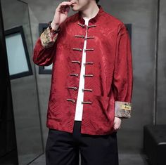 This red Tang jacket is made from brocade fabric, featuring a rich, intricate pattern with a subtle sheen. Adorned with traditional frog buttons and classic Mandarin collar while the cuffs are accented with contrasting fabric and intricate designs that beautifully complement the overall aesthetic. This modern Tang suit combines timeless elegance with contemporary style. Please note the jacket size is CN size which is smaller than US/EU/AU sizes, refer to the size chart in the picture. Size Shoul Chinese Suit Men, Chinese Suit, Frog Buttons, Chinese Brocade, Qipao Cheongsam, Tang Suit, Cultural Celebration, Embroidery Gifts, Wedding Essentials