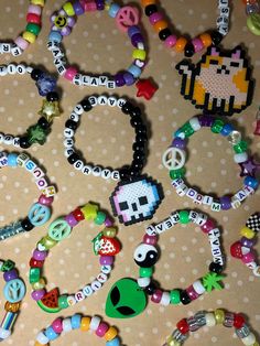 Five random kandi bracelets made with love! Each kandi is custom, cute, and quality! The mix of kandi will include: 1 bracelet with a medium/large perler charm attached  1 bracelet with a small perler charm attached 3 singles with various phrases and specialty beads  some bracelets/phrases will not be family friendly message me for any custom requests and I will try to accommodate! Kandi Display, Kandi With Perler, Kandi Bracelets Ideas Singles, Bracelet Inspo Aesthetic, Rave Kandi Bracelets Ideas, Kandi Quotes, Kandi Phrases, Funny Kandi Bracelets, Kandi Bracelets Patterns