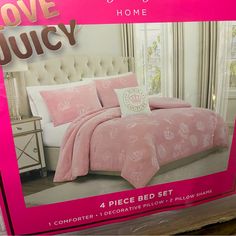 a pink bed set in a box with the words love juicy on it and an image of