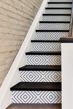 some black and white tiles are on the stairs