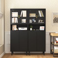 a room with a bookcase and some books on the shelves next to a desk