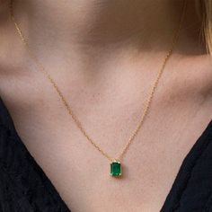 Sep 23, 2020 - An Elegant and simply stunning Green Emerald necklace. This handmade piece of jewelry is set with a 8x6 Green Emereald Chatham in the deepest and most beautiful Colombian Green.. The setting itself is vintage inspired in its simplicity and holds the stone securely whilst allowing for maximum light Emerald Necklace With Delicate Chain As Gift, Emerald Necklace With Delicate Chain For Gift, Emerald Jewelry With Delicate Chain As Gift, Emerald Jewelry With Delicate Chain For Gift, Emerald Cut Gold Solitaire Necklace, Fine Jewelry Necklace With Jewels For Gift, Gold Plated May Birthstone Formal Necklaces, Gold Emerald Cut Necklace For May Birthstone, Dainty Emerald Cut Yellow Gold Necklace