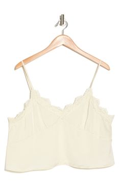 Showcase your sultry style in this flattering cropped camisole trimmed with lovely lace. 20" length (size 1X) V-neck Spaghetti straps 100% polyester Hand wash, line dry Imported V-neck Lace Crop Top With Lace Trim, V-neck Tank Top With Lace Trim For Daywear, Cropped Lace Tank Top With Lace Trim, Chic Cropped Lace Trim Tank Top, Chic Spaghetti Strap Crop Top With Lace Trim, Chic V-neck Tank Top With Delicate Lace, Summer Sleeveless Lace Top, Bra Friendly, Cami Crop Top With Lace Trim, Summer Sleeveless Bra-friendly Lace Top