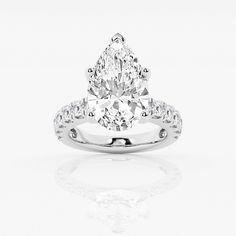 a pear shaped diamond ring on a white background