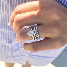 a woman's hand with two rings on it